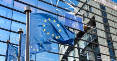 european union flag against european parliament