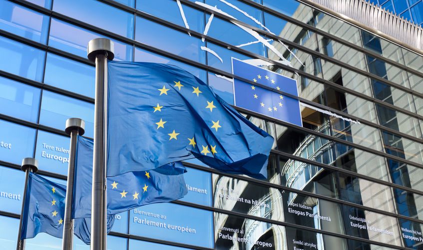 european union flag against european parliament